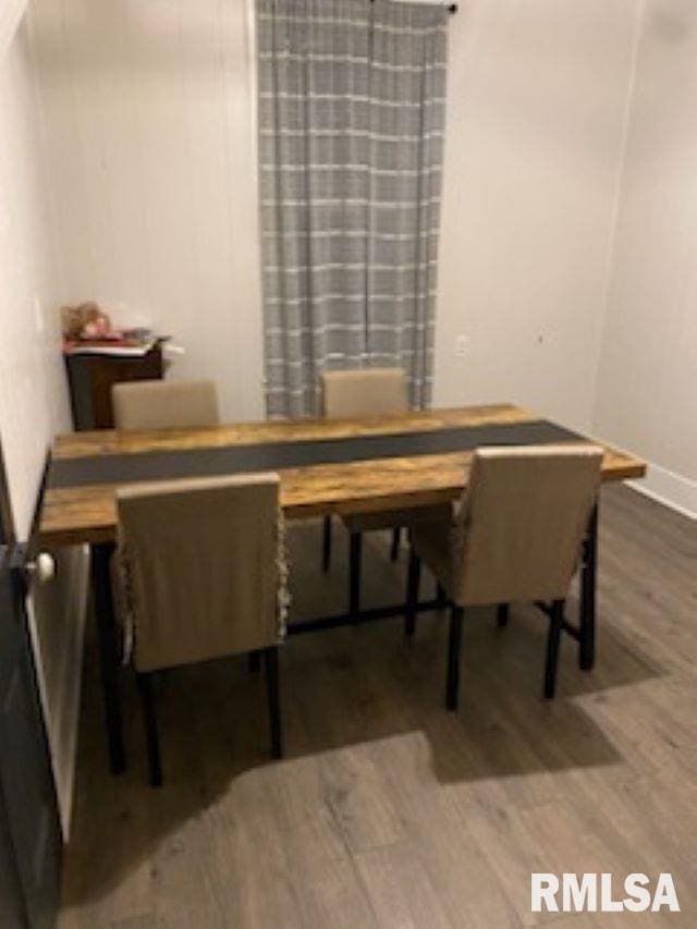 501 E Broad St, Jonesboro, IL 62952 - dining room featuring baseboards and wood finished floors