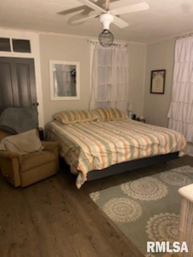501 E Broad St, Jonesboro, IL 62952 - bedroom featuring ceiling fan, ornamental molding, and wood finished floors