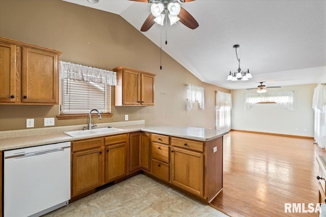 5200 Villa Dr, Davenport, IA 52806 - kitchen with white dishwasher, ceiling fan, a sink, light countertops, and a peninsula