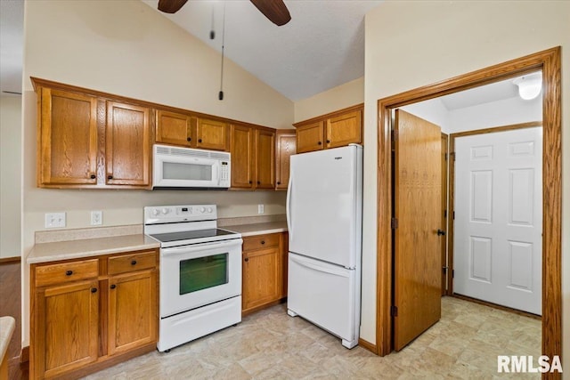 5200 Villa Dr, Davenport, IA 52806 - kitchen featuring brown cabinets, ceiling fan, white appliances, and lofted ceiling