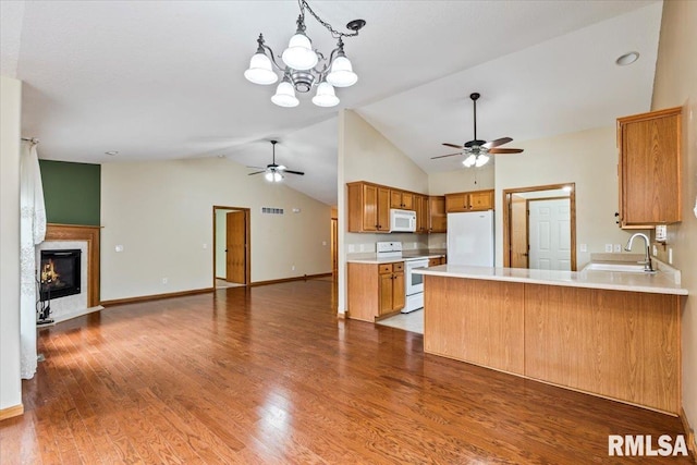 5200 Villa Dr, Davenport, IA 52806 - kitchen featuring open floor plan, a sink, ceiling fan with notable chandelier, and white appliances