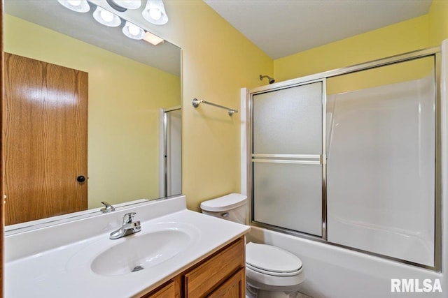 5200 Villa Dr, Davenport, IA 52806 - bathroom featuring vanity, enclosed tub / shower combo, and toilet