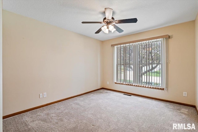 5200 Villa Dr, Davenport, IA 52806 - carpeted spare room with a ceiling fan, baseboards, visible vents, and plenty of natural light