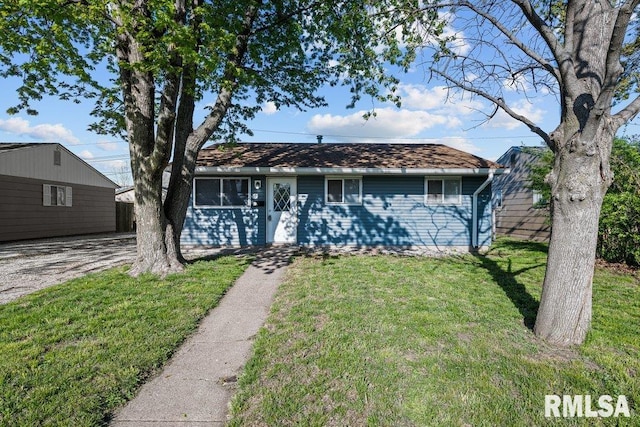 single story home with a front yard