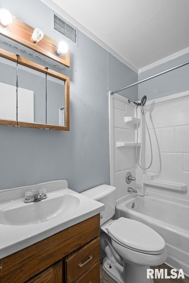 full bath with toilet, visible vents, tub / shower combination, and vanity