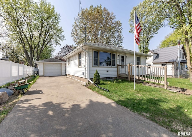 bungalow-style home featuring fence, an outbuilding, a front yard, and a garage