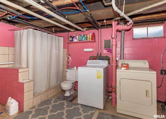 washroom featuring laundry area and washing machine and dryer