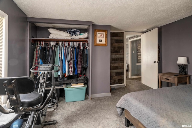 510 W Idaho Ave, Carterville, IL 62918 - carpeted bedroom with a closet, a textured ceiling, and baseboards