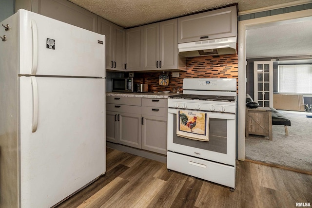 510 W Idaho Ave, Carterville, IL 62918 - kitchen with white appliances, under cabinet range hood, gray cabinetry, dark wood-style flooring, and a textured ceiling