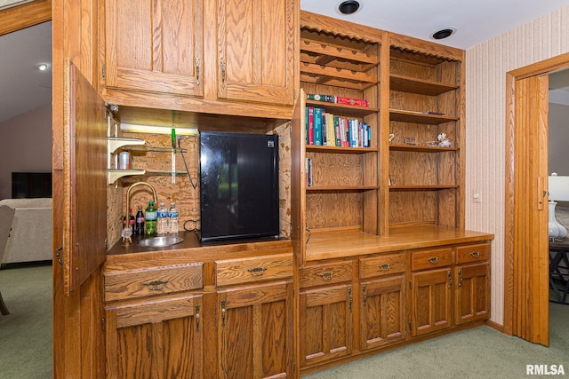 28018 230th St, Le Claire, IA 52753 - details featuring a sink, carpet flooring, and wallpapered walls
