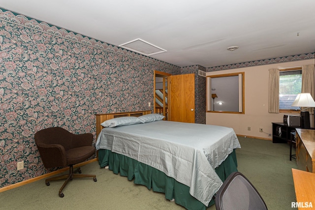 28018 230th St, Le Claire, IA 52753 - bedroom featuring carpet floors, wallpapered walls, baseboards, and attic access