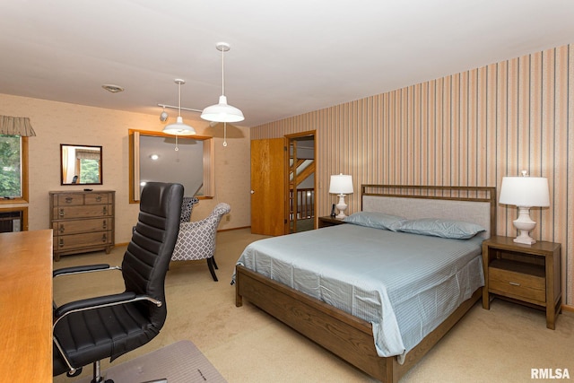 28018 230th St, Le Claire, IA 52753 - bedroom with light carpet and wallpapered walls