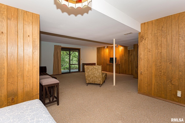 28018 230th St, Le Claire, IA 52753 - sitting room with carpet floors, wood walls, and visible vents
