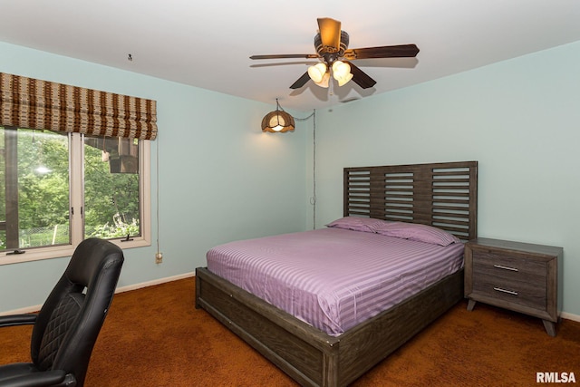 28018 230th St, Le Claire, IA 52753 - bedroom featuring baseboards, carpet, and ceiling fan