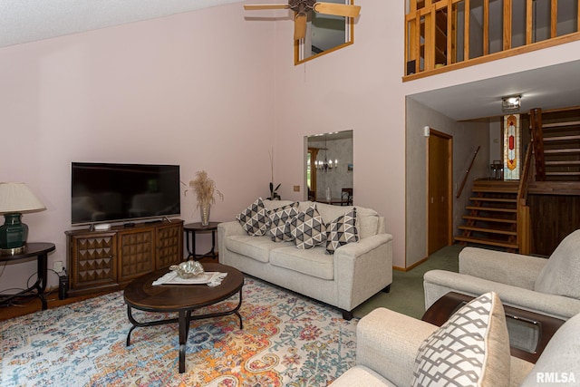 28018 230th St, Le Claire, IA 52753 - living room with stairway, a high ceiling, and a ceiling fan