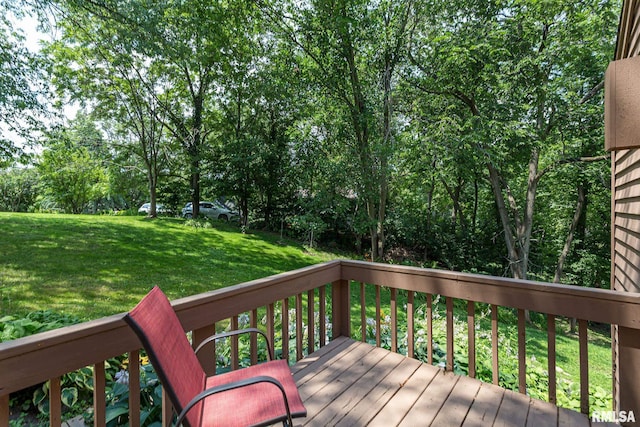 28018 230th St, Le Claire, IA 52753 - wooden deck featuring a yard