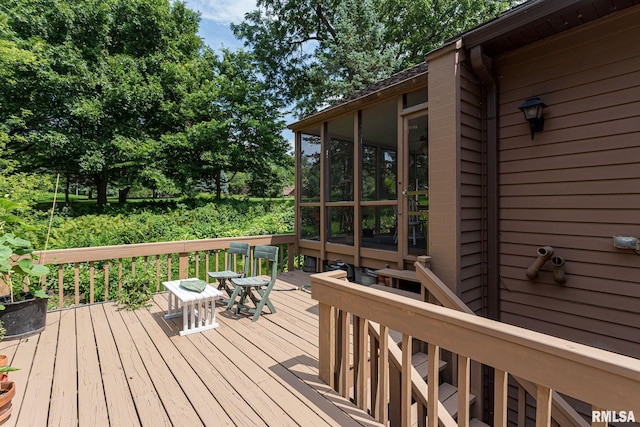 28018 230th St, Le Claire, IA 52753 - wooden terrace featuring a sunroom