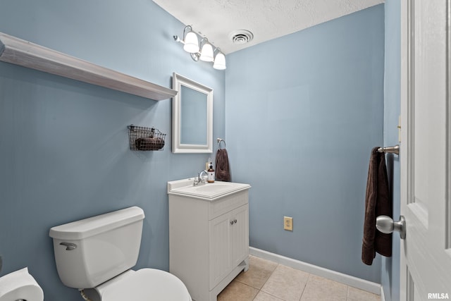 6135 Hillandale Rd, Davenport, IA 52806 - bathroom with visible vents, tile patterned floors, baseboards, vanity, and toilet