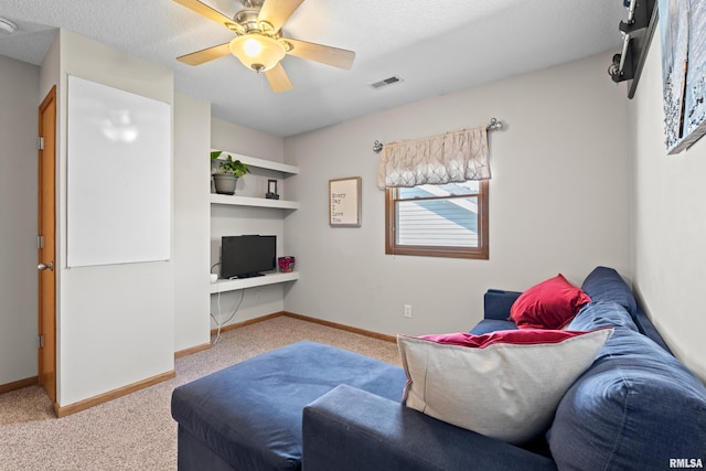 6135 Hillandale Rd, Davenport, IA 52806 - living room featuring visible vents, baseboards, carpet floors, and ceiling fan