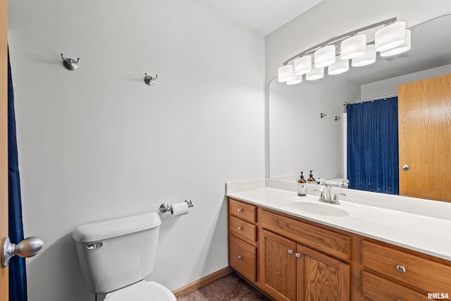 6135 Hillandale Rd, Davenport, IA 52806 - full bathroom featuring vanity, baseboards, and toilet
