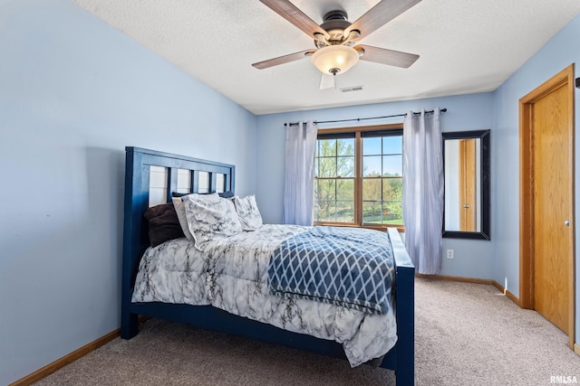 6135 Hillandale Rd, Davenport, IA 52806 - bedroom featuring a textured ceiling, baseboards, and carpet