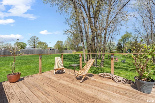 6135 Hillandale Rd, Davenport, IA 52806 - wooden terrace with a fenced backyard and a lawn