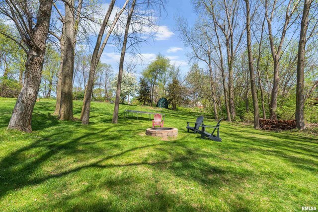 6135 Hillandale Rd, Davenport, IA 52806 - view of yard featuring a fire pit