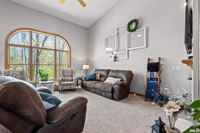 6135 Hillandale Rd, Davenport, IA 52806 - living room with baseboards, ceiling fan, vaulted ceiling, and carpet flooring