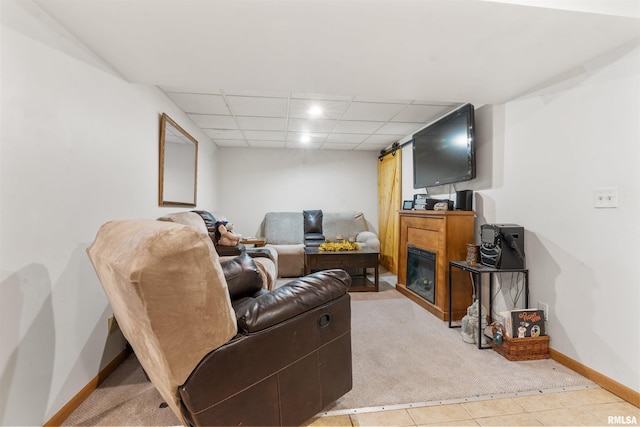 4012 172nd St N, East Moline, IL 61244 - living area featuring carpet floors, baseboards, a drop ceiling, and tile patterned floors