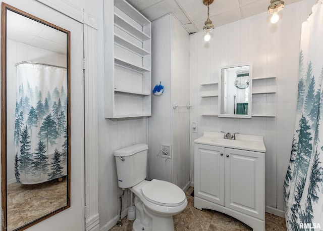 bathroom featuring vanity, baseboards, toilet, and a shower with curtain