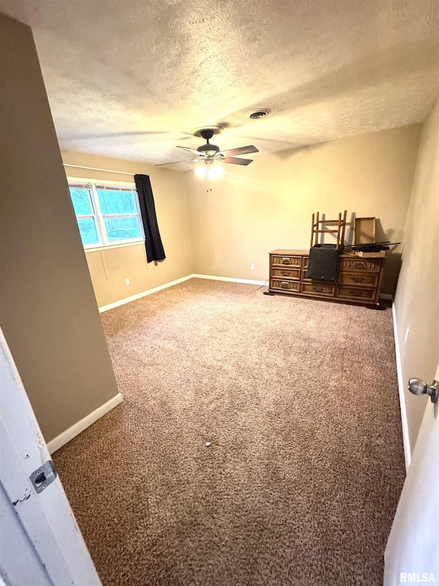 1001 W 6th St, West Frankfort, IL 62896 - interior space featuring carpet floors, a textured ceiling, visible vents, and baseboards