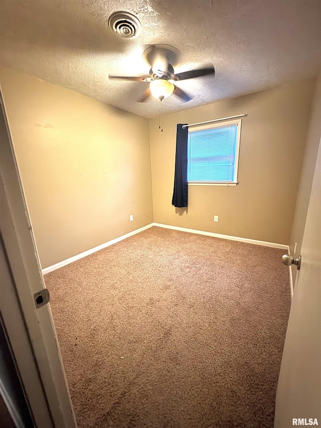 1001 W 6th St, West Frankfort, IL 62896 - unfurnished room with visible vents, carpet, ceiling fan, and baseboards