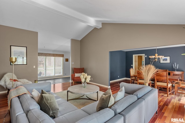 living room featuring baseboards, vaulted ceiling with beams, wood finished floors, and a notable chandelier