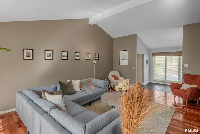 living room with baseboards, lofted ceiling with beams, and wood finished floors