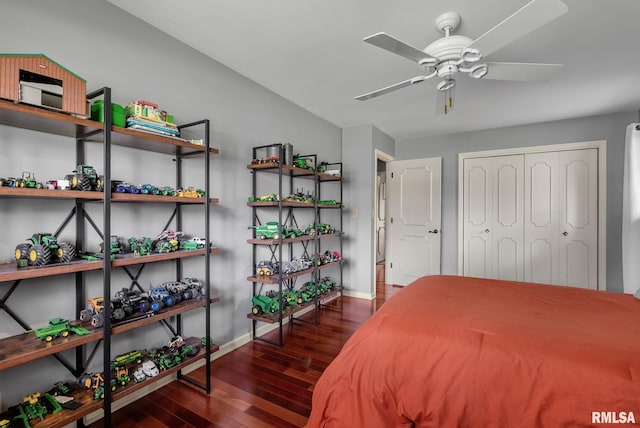 bedroom featuring baseboards, a closet, and wood finished floors
