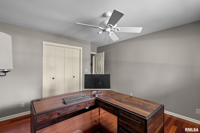 office area with baseboards, a ceiling fan, and wood finished floors