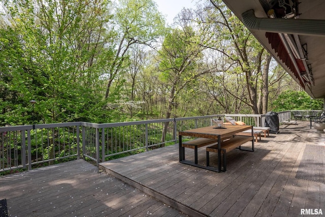 wooden deck with outdoor dining space