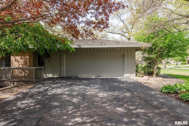 garage with aphalt driveway