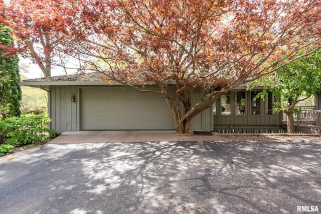 view of front of home with concrete driveway and an attached garage