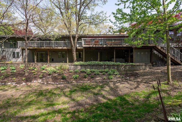 back of house with stairway and a wooden deck