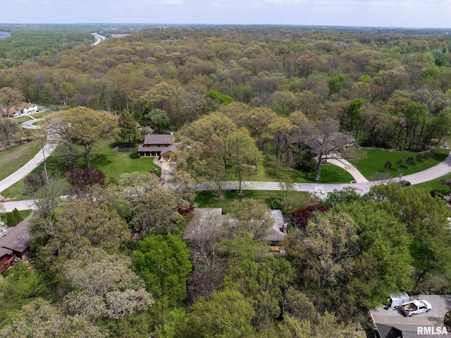 aerial view featuring a wooded view