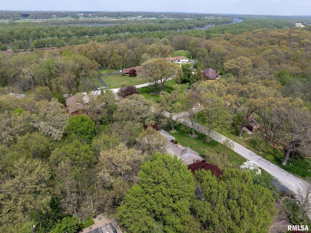 drone / aerial view featuring a view of trees