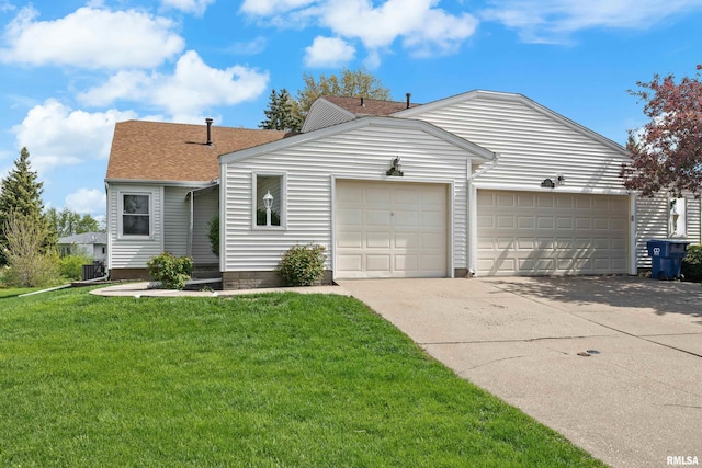 view of front of home with a front yard, driveway, roof with shingles, and a garage
