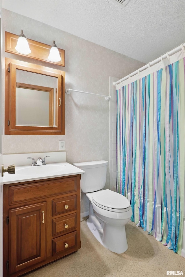 full bathroom with toilet, a textured ceiling, curtained shower, and vanity