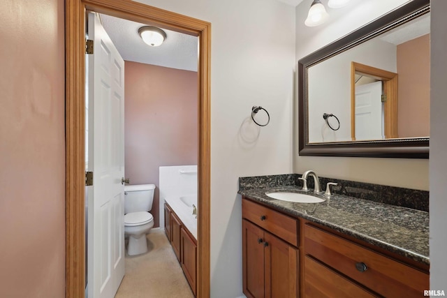 full bath with toilet and vanity