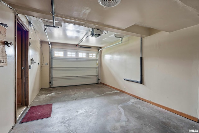 garage featuring baseboards and a garage door opener