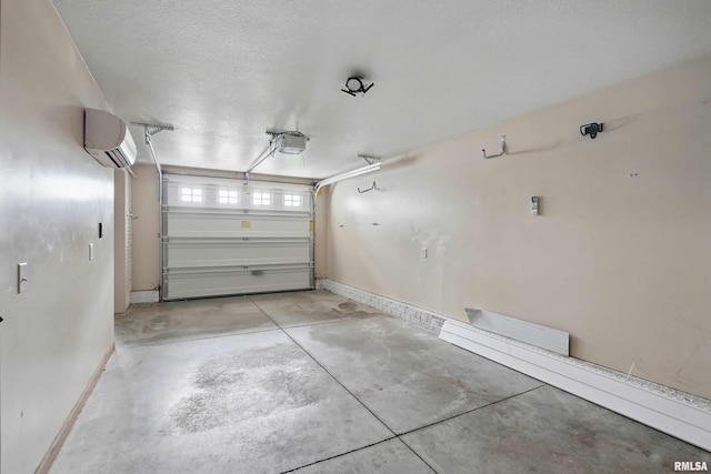 garage with baseboards, a wall mounted AC, and a garage door opener