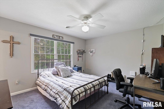 bedroom featuring carpet floors, a textured ceiling, baseboards, and a ceiling fan
