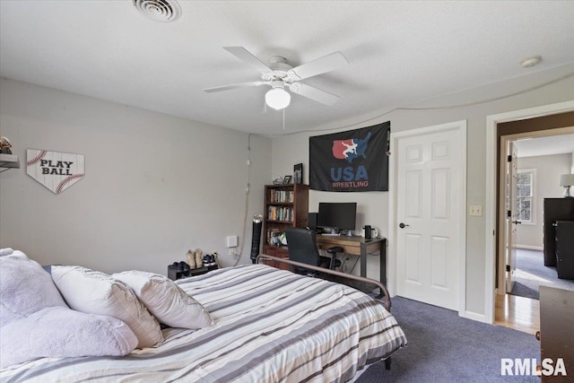bedroom with carpet floors, ceiling fan, and visible vents
