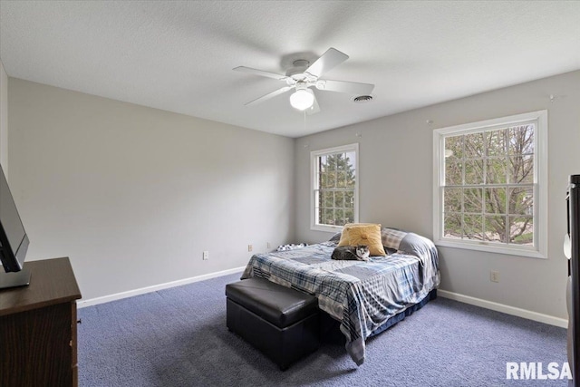 bedroom featuring visible vents, carpet flooring, baseboards, and ceiling fan